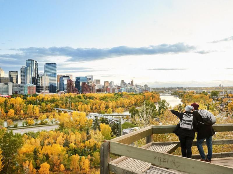 A couple overlooking the city of Calgary, Canada