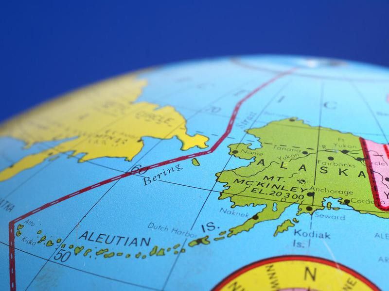 A round globe focused on Alaska.