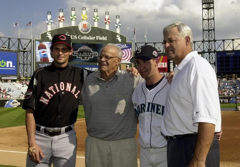 Aaron Boone and Bret Boone pose with grandfather Ray and father Bob before MLB All-Star Game