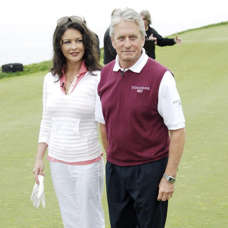 Actress Catherine Zeta-Jones and Michael Douglass on golf course