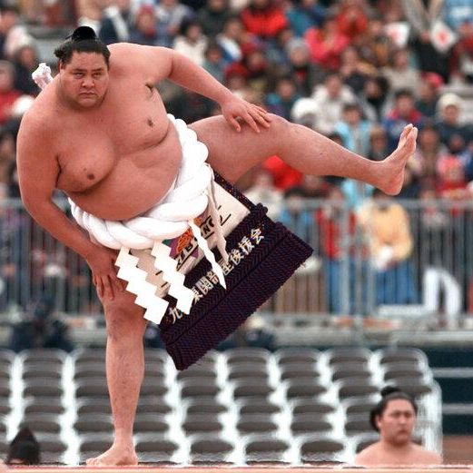 Sumo Grand Champion Akebono performs a Dohyoiri or ring-entering ceremony during the opening ceremony of the XVIII Winter Olympics at the Minami Nagano Sports Park in Nagano Saturday, Feb. 7, 1998. (AP Photol/Eric Draper)