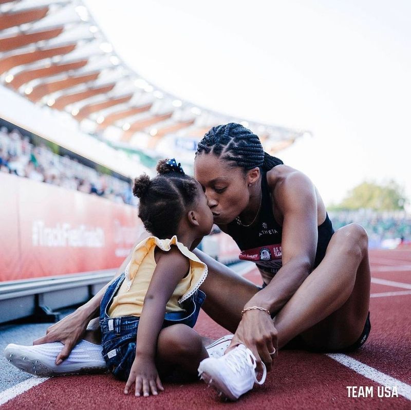 Allyson Felix and her daughter embracing