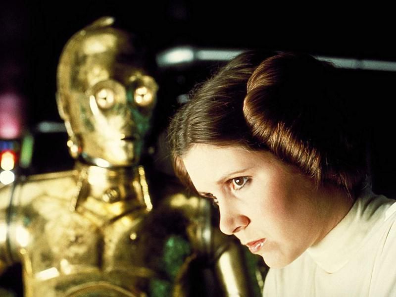 Anthony Daniels and Carrie Fisher in Star Wars (1977)