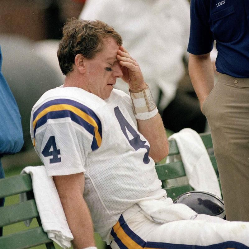 Archie Manning sits dejected on sidelines