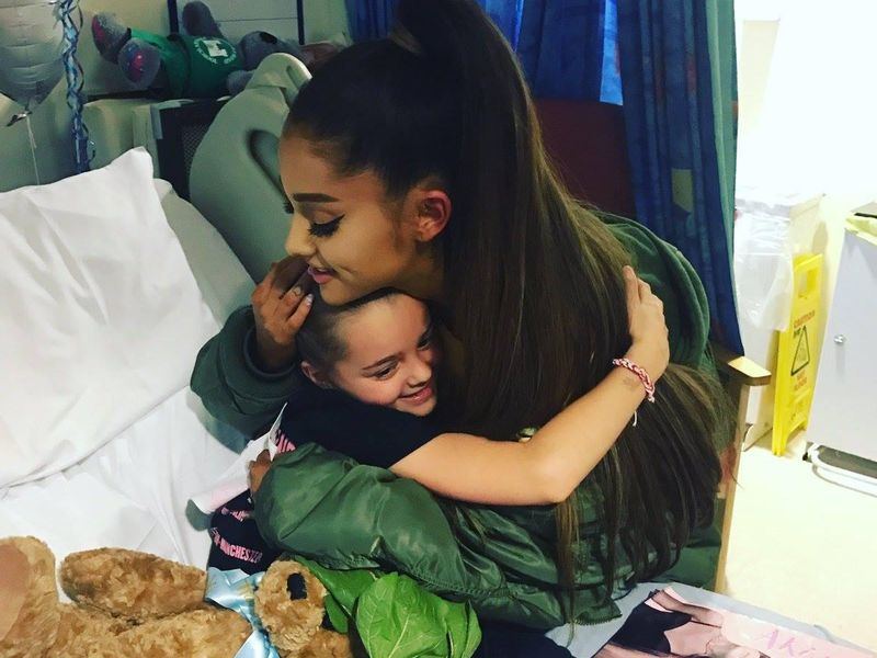 Ariana Grande hugs victim