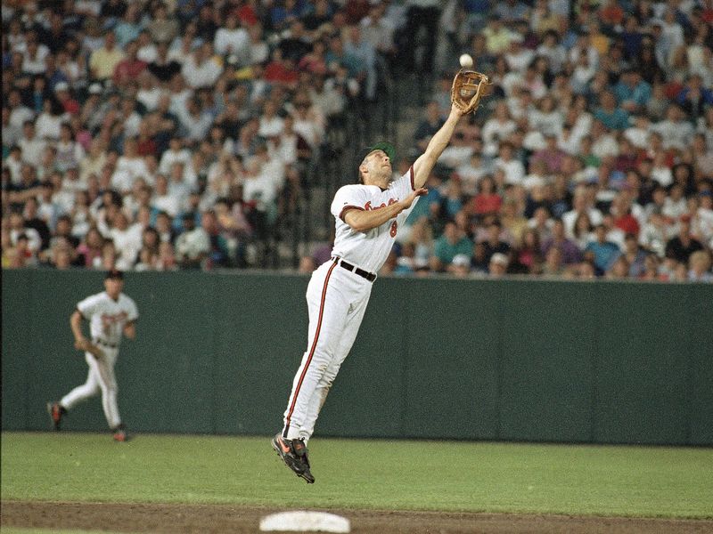 Baltimore Orioles shortstop Carl Ripken Jr. leaps to make a play