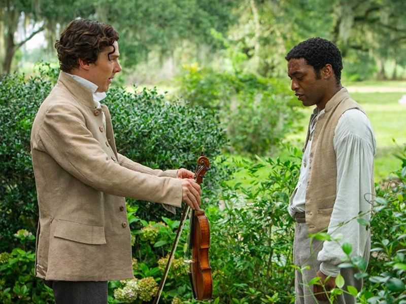 Benedict Cumberbatch offering violin to Chiwetel Ejiofor in 12 Years a Slave