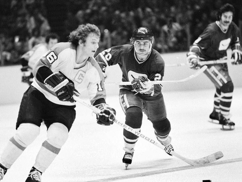 Bobby Clarke takes puck down ice