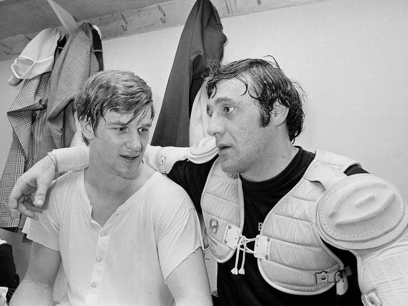 Bobby Orr and Phil Esposito pose for photographers in the dressing room