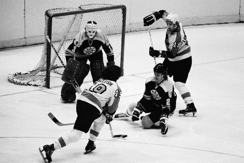 Boston Bruins goalie Gil Gilbert and defenseman Al Sims