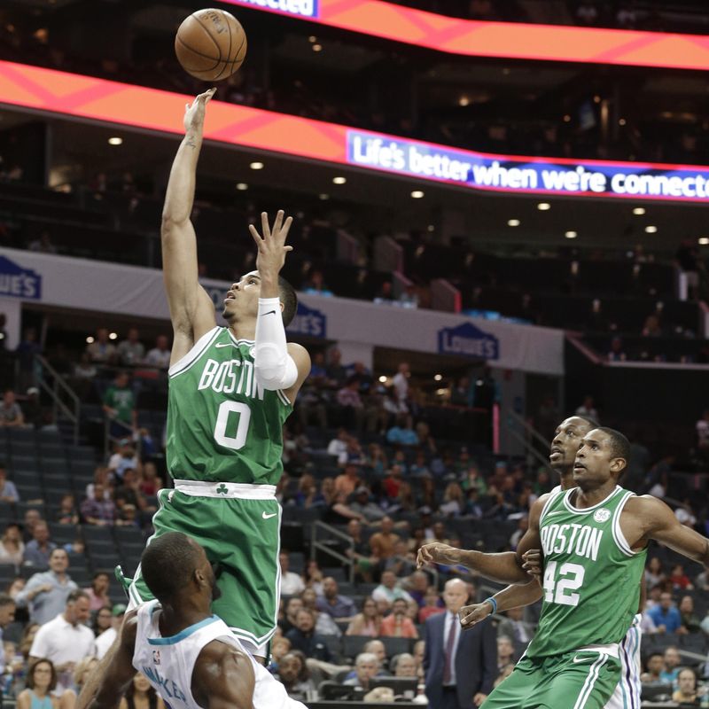 Boston Celtics' Jayson Tatum runs into Charlotte Hornets' Kemba Walker