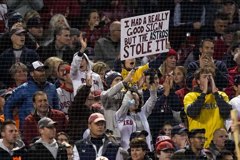 Boston Red Sox fan holds sign