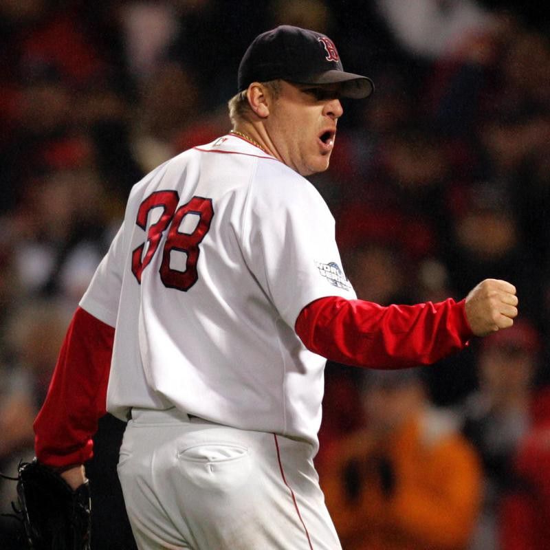 Boston Red Sox pitcher Curt Schilling pumps fist