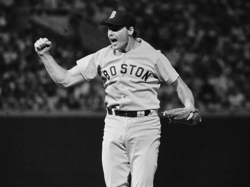 Boston Red Sox pitcher Roger Clemens celebrates
