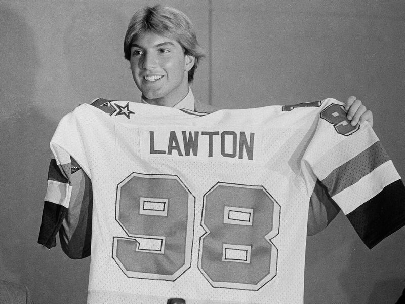Brian Lawton holds up jersey