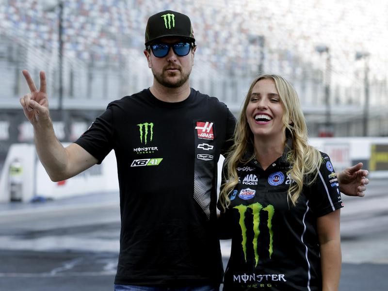 Brittany Force laughs with NASCAR driver Kurt Busch