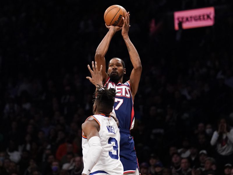 Brooklyn Nets forward Kevin Durant shoots 3-point basket over New York Knicks center Nerlens Noel