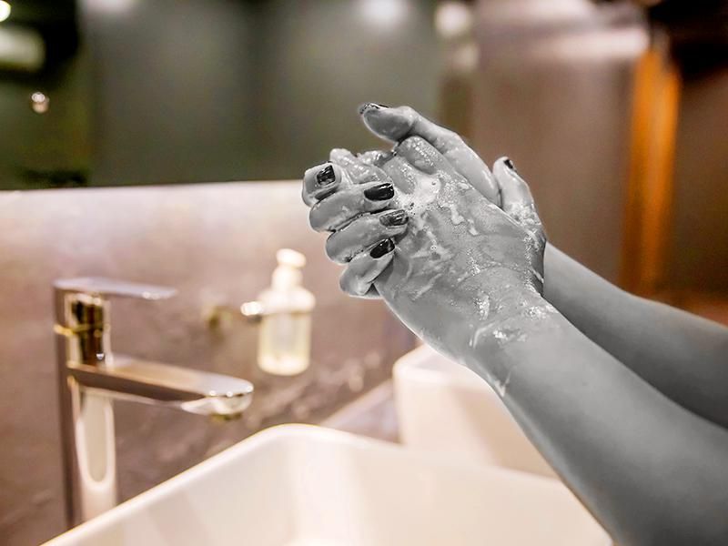 Business woman hand washing with soap