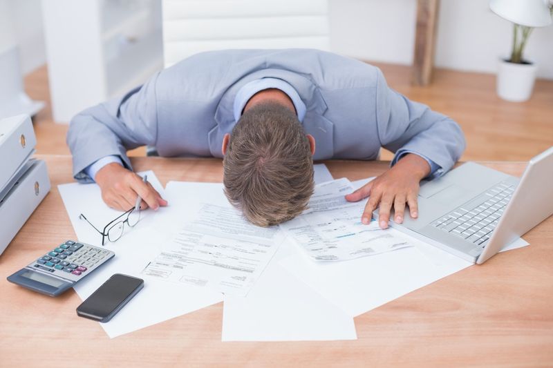 Businessman being depressed by accounting
