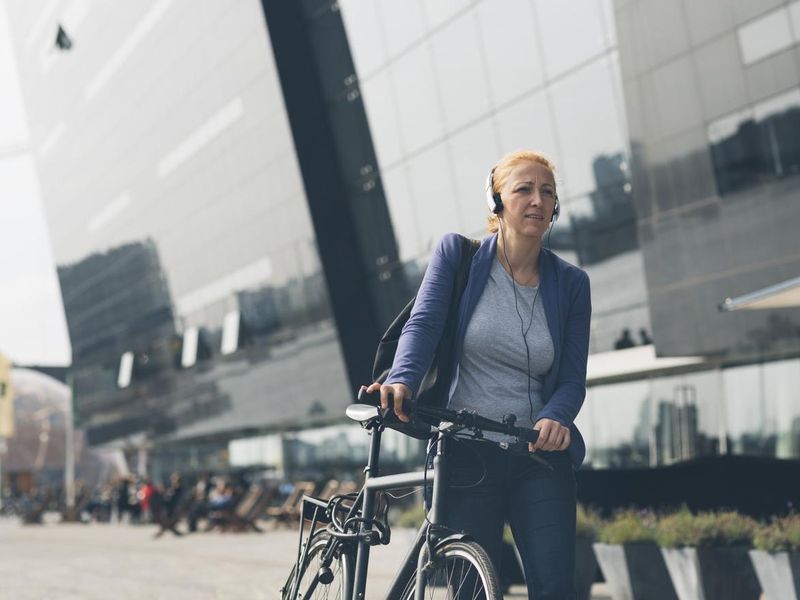 Businesswoman biking home in Copenhagen