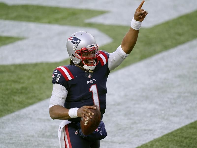 Cam Newton of the New England Patriots celebrates touchdown catch
