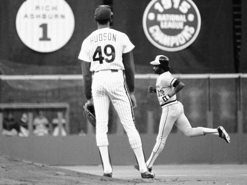 Charles Hudson watches Baltimore Orioles slugger Eddie Murray round the bases