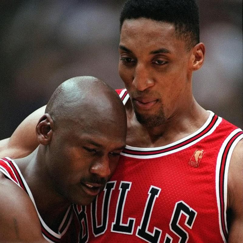 Chicago Bulls' Scottie Pippen embraces exhausted Michael Jordan
