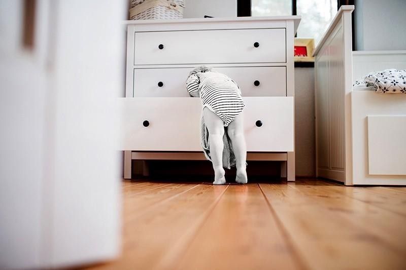 child looking in drawers