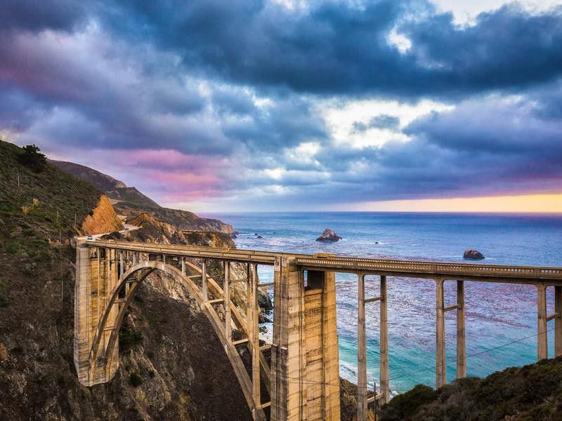 Classic view of historic Bixby Bridge along famous Highway 1 in twilight, Big Sur, California, USA