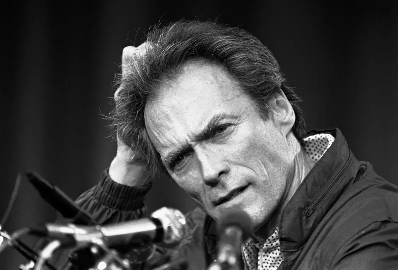 Clint Eastwood pauses at a press conference for his film "Pale Rider," at the Cannes Film Festival in France, on May 13, 1985.