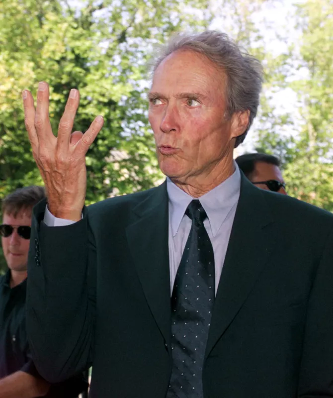 Clint Eastwood gestures upon his arrival at the Lido in Venice, Italy, August 30, 2000.