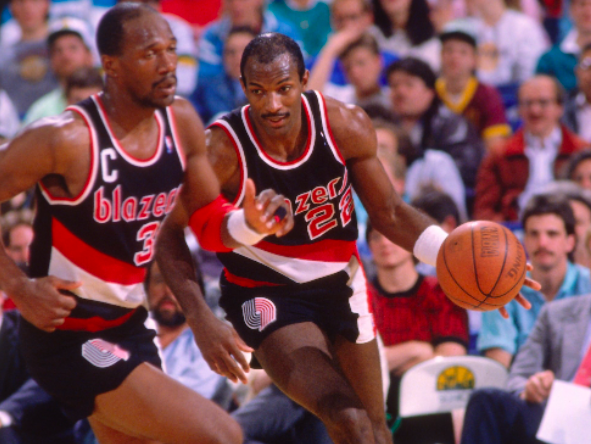 Clyde Drexler and Terry Porter in action