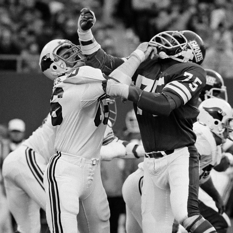 Conrad Dobler attempts to block George Martin of the New York Giants