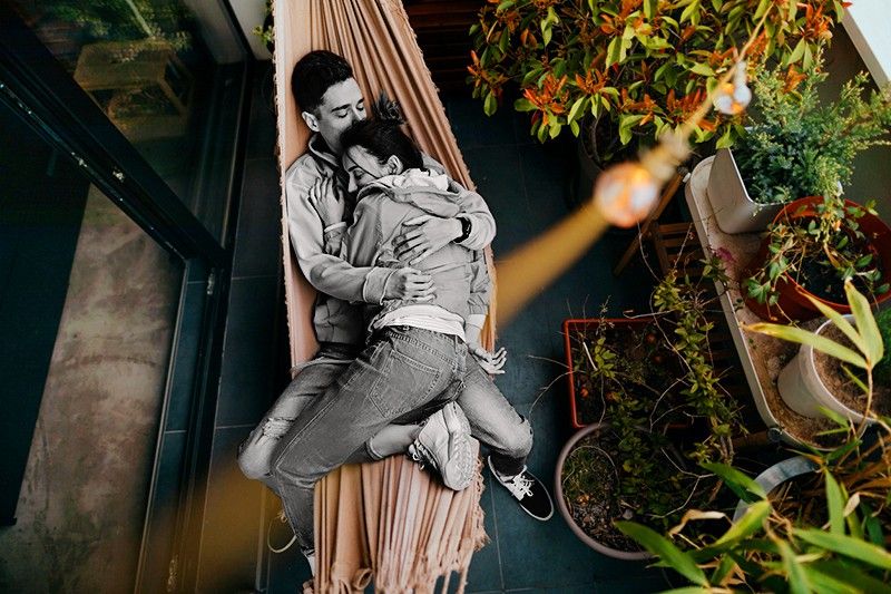 Couple having a relaxing moment in a hammock