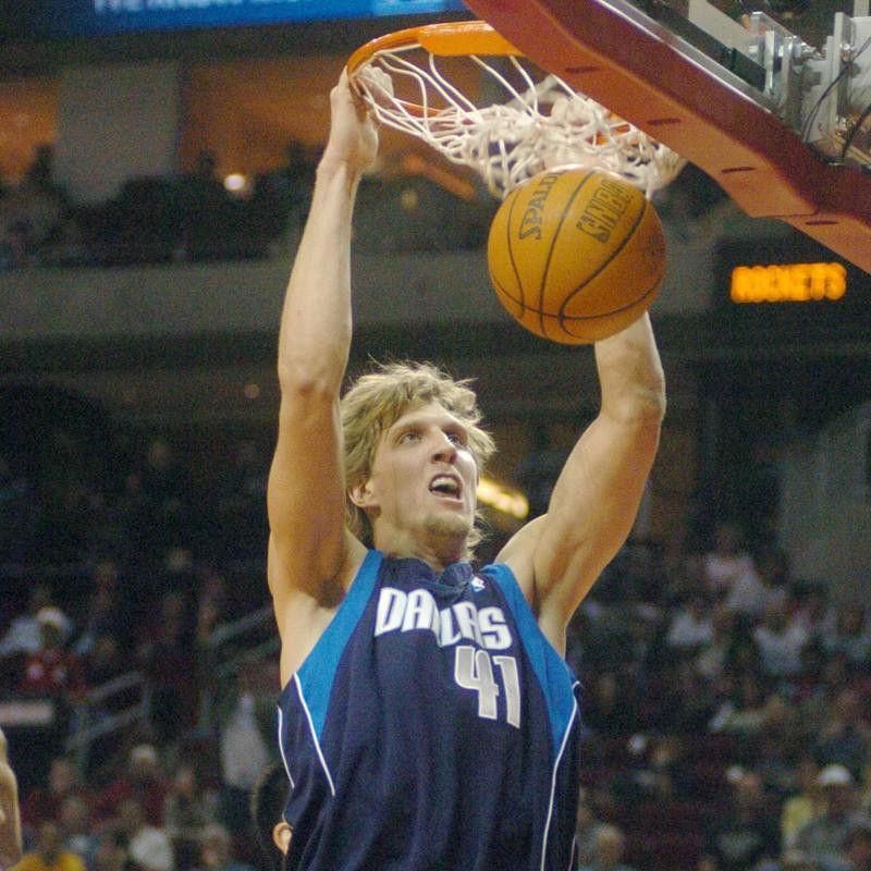 Dallas Mavericks' Dirk Nowitzk slam dunks ball