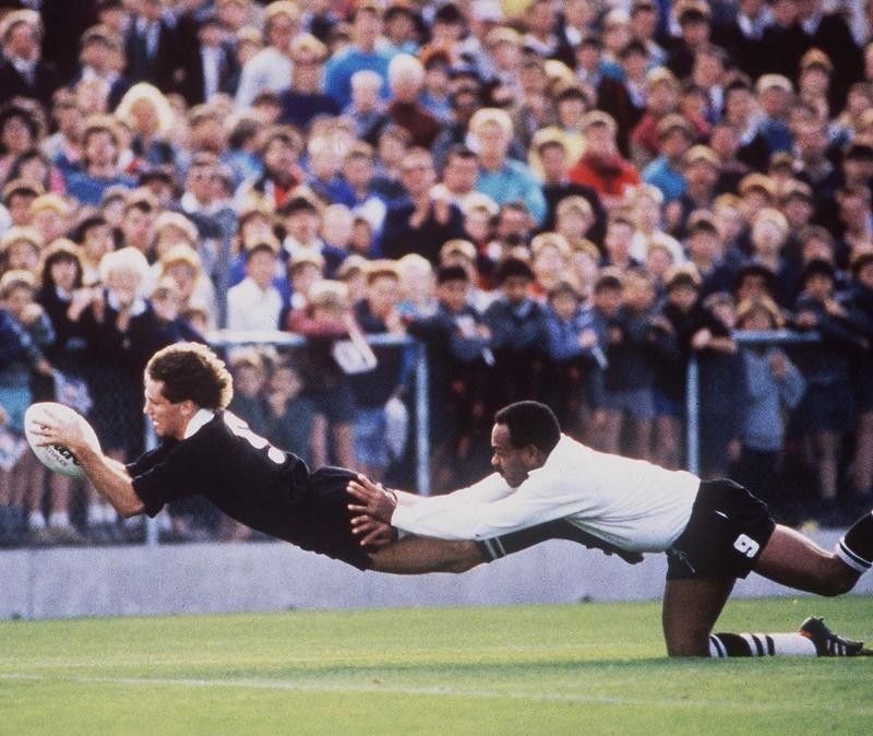 David Kirk of the All Blacks scores try during Rugby World Cup match against Fiji in 1987