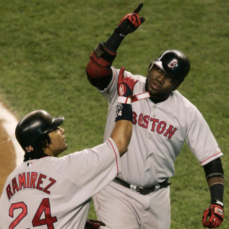 David Ortiz and Manny Ramirez react after Ortiz hit a two-run home run
