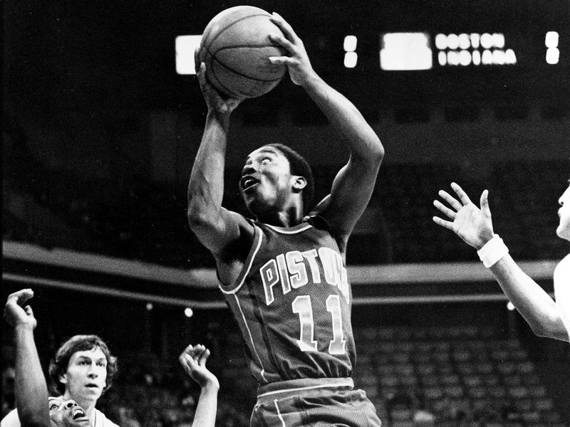 Detroit Pistons guard Isiah Thomas goes up, twists, and shoots