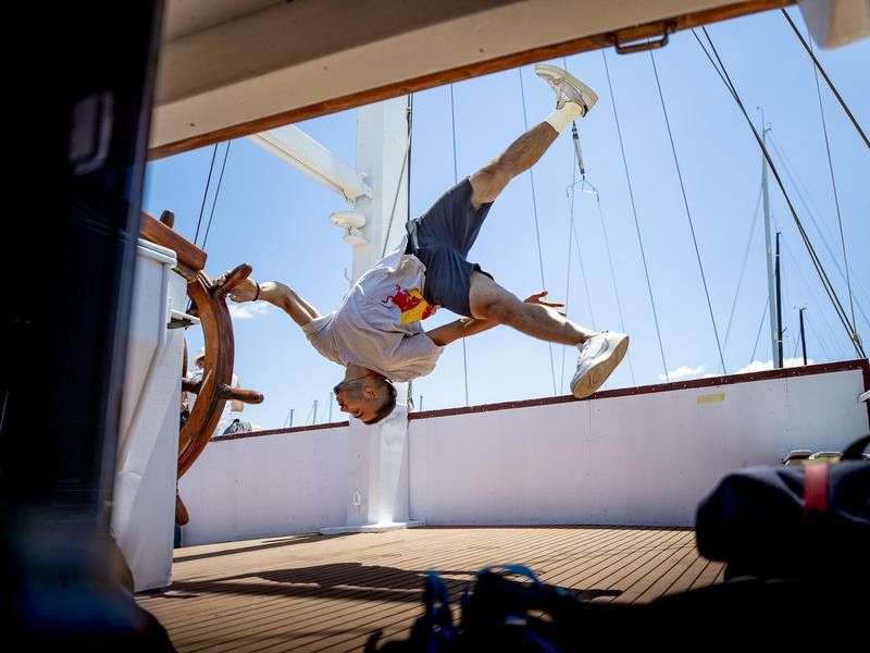 Dimitris Kyrsanidis holds ship wheel to do trick