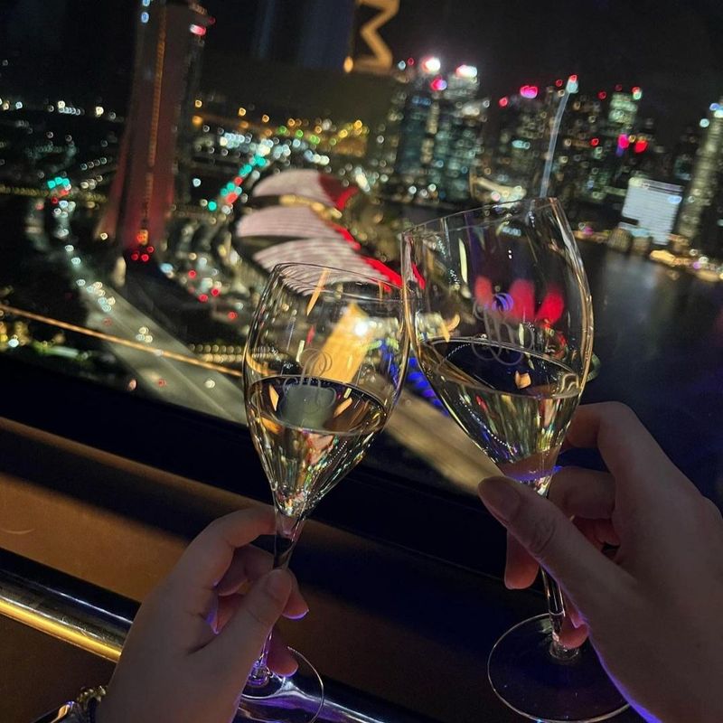 Drinking champagne in Singapore Ferris wheel