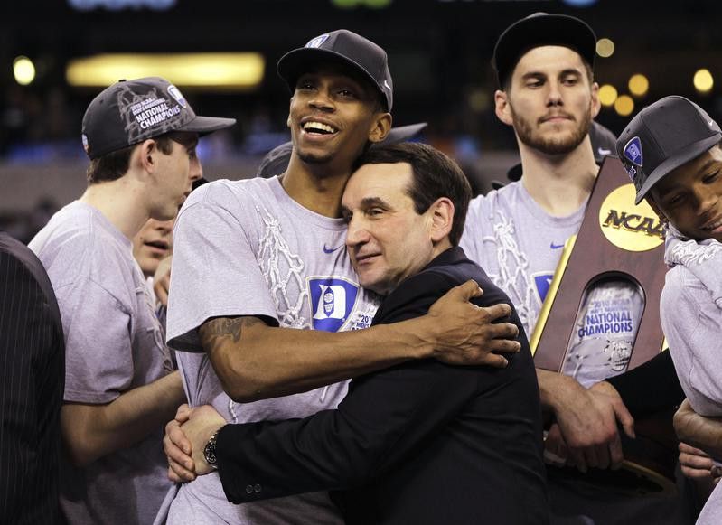 Duke coach Mike Krzyzewski and guard Lance Thomas embrace after win over Butler