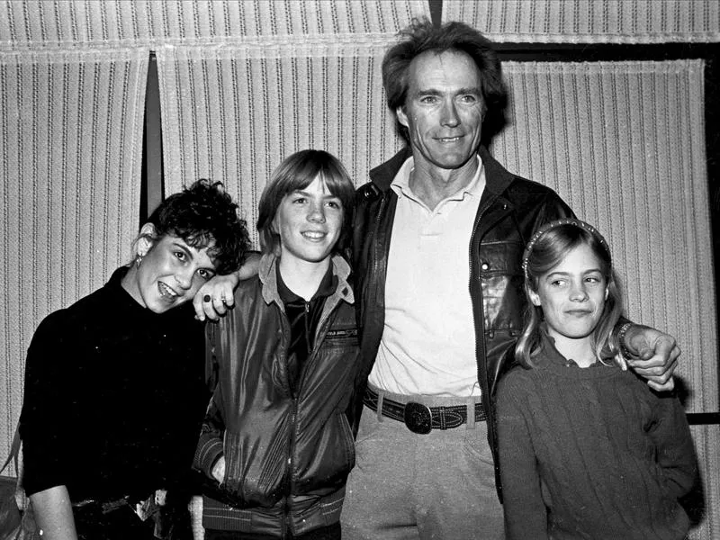 Clint Eastwood stands with with Alexa Kenin (left), his son Kyle (middle left) and his daughter Alison (right) at a screening of his movie "Honkytonk Man" in 1982.