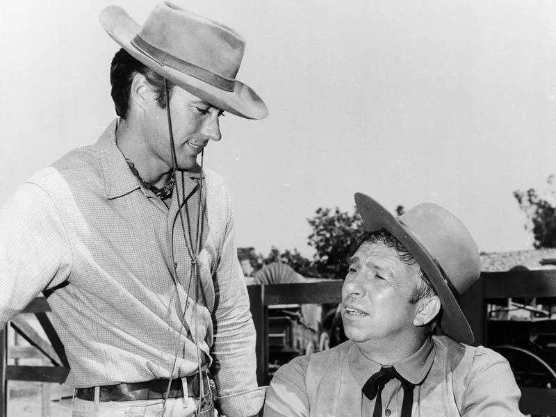 Clint Eastwood, with Slim Pickens, acts on the set of "Rawhide" in 1965.