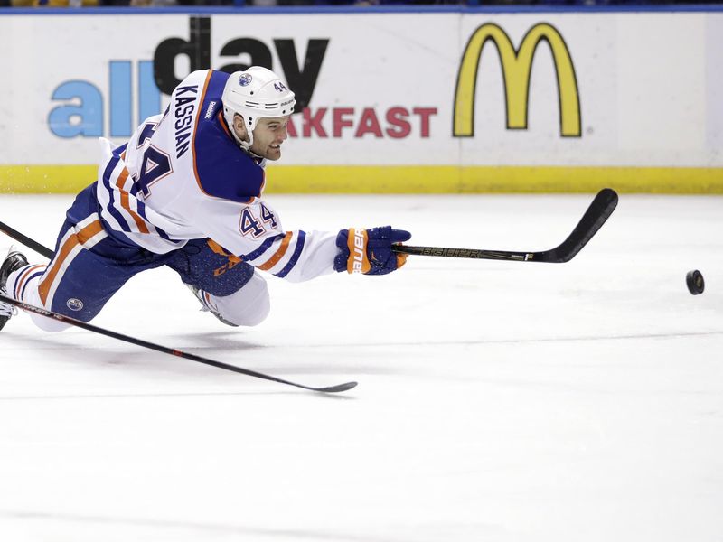 Edmonton Oilers' Zack Kassian tries to get shot off during third period