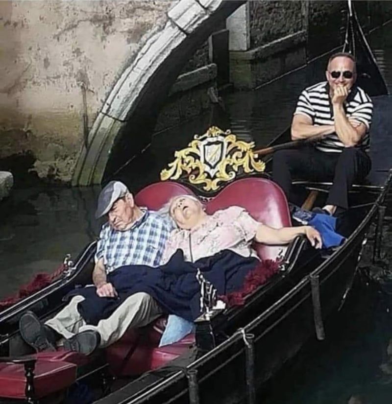 Elderly couple asleep on a boat