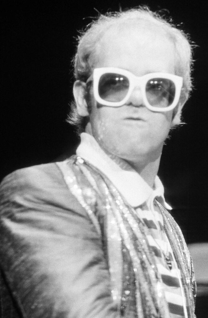 Elton John performs at the piano at New York's Madison Square Garden, August 10, 1976. (AP Photo)