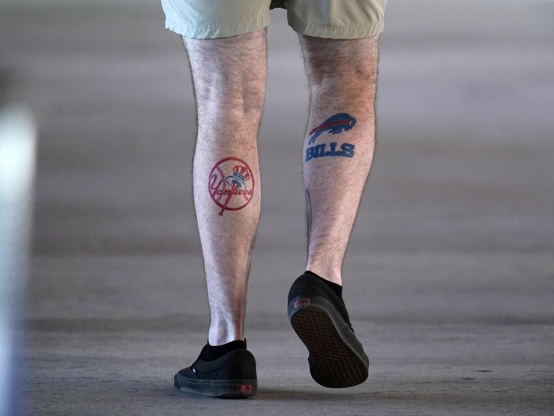 Fan with Yankee and Bills tattoos