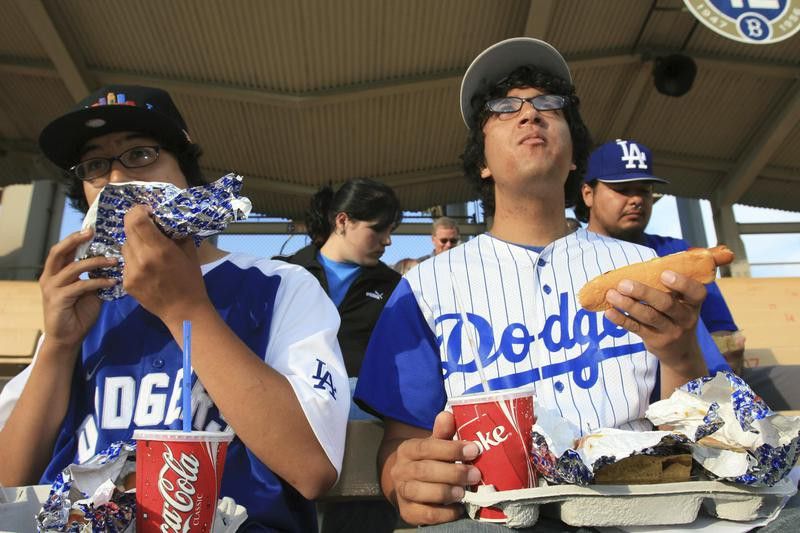 Fans eat hot dogs