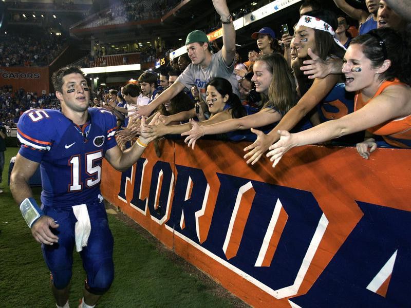 Florida quarterback Tim Tebow high-fives fans