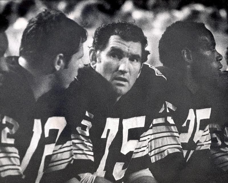 Forrest Gregg sits on bench with Green Bay Packers teammates